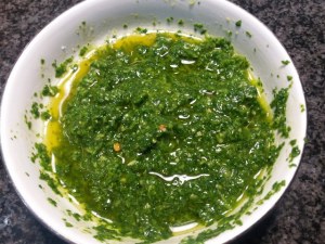 Fusilli al ferretto con pesto di rucola polpo e pomodorini gialli e rossi