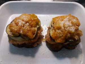 Parmigiana di melanzane ed alici con pomodoro giallo e tarallo sbriciolato
