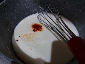 Timballo di tagliatelle con puntarelle salsiccia e crema di parmigiano allo zafferano