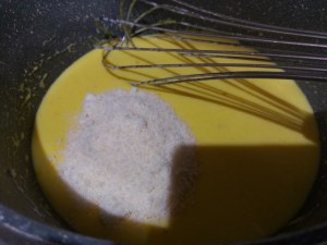 Timballo di tagliatelle con puntarelle salsiccia e crema di parmigiano allo zafferano