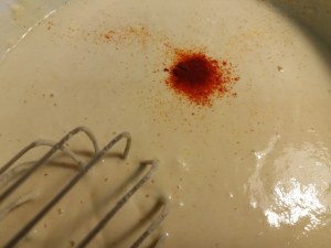 Fiori di zucca in pastella allo zafferano ripieni di ricotta di bufala provola e pesto di pistacchi