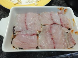 Parmigiana di melanzane e pesce lampuga