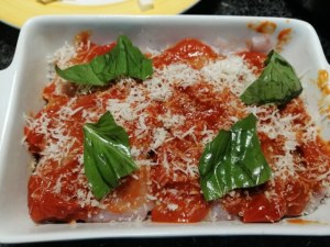 Parmigiana di melanzane e pesce lampuga