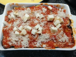 Parmigiana di melanzane e pesce lampuga