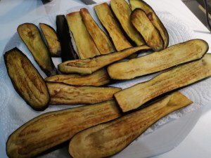 Parmigiana di melanzane e pesce lampuga