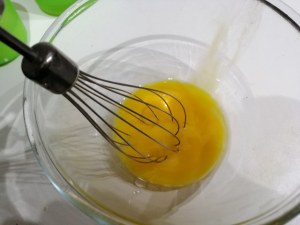 Gnudi di ricotta e spinaci su zabaione salato con pepe rosa