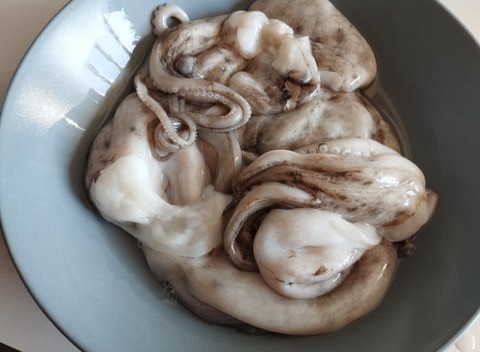 Moscardini alla luciana con polenta